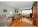 Traditional living room with hardwood floors, fireplace, and ample natural light at 250 Rosery Nw Rd # 218, Largo, FL 33770
