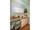 Bright office featuring hardwood floors, a large desk, and natural light at 250 Rosery Nw Rd # 218, Largo, FL 33770