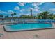 Community pool with sparkling water, clear blue skies, and ample space for swimming laps at 250 Rosery Nw Rd # 218, Largo, FL 33770