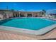 Large community pool with patio and seating for residents to relax and socialize in a pleasant atmosphere at 250 Rosery Nw Rd # 218, Largo, FL 33770