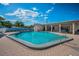 Inviting community pool with lounge seating for residents to relax and enjoy the Florida weather at 250 Rosery Nw Rd # 218, Largo, FL 33770