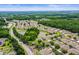 Scenic view of an attractive community featuring well-spaced houses, tranquil ponds, and abundant green spaces at 31108 Whitlock Dr, Wesley Chapel, FL 33543