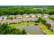 Wonderful homes with lush green lawns overlooking a beautiful pond, offering a peaceful and picturesque setting at 31108 Whitlock Dr, Wesley Chapel, FL 33543