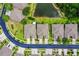 Overhead shot featuring attractive homes with well-kept landscaping and a quiet street in a desirable community at 31108 Whitlock Dr, Wesley Chapel, FL 33543