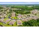 This captivating aerial view showcases a peaceful neighborhood dotted with ponds and lush landscaping at 31108 Whitlock Dr, Wesley Chapel, FL 33543