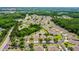 Gorgeous community with lush landscaping, serene ponds, and neatly arranged homes creating a harmonious neighborhood at 31108 Whitlock Dr, Wesley Chapel, FL 33543