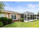 Spacious backyard with a screened patio and well-maintained lawn, ideal for relaxation at 31108 Whitlock Dr, Wesley Chapel, FL 33543