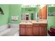 Bathroom featuring a double vanity and large soaking tub at 31108 Whitlock Dr, Wesley Chapel, FL 33543