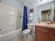Bathroom with a shower-tub combo and vanity with sink at 31108 Whitlock Dr, Wesley Chapel, FL 33543