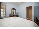 Comfortable bedroom with natural lighting and a mirrored dresser, showcasing the room's cozy ambiance at 31108 Whitlock Dr, Wesley Chapel, FL 33543