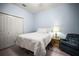 Cozy bedroom with soft lighting, plush bedding, and a calming color scheme at 31108 Whitlock Dr, Wesley Chapel, FL 33543