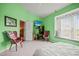 Inviting bedroom with a window seat, stylish seating, and ample natural light at 31108 Whitlock Dr, Wesley Chapel, FL 33543