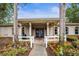 Exterior of the community clubhouse with palm trees and colorful flowers at 31108 Whitlock Dr, Wesley Chapel, FL 33543