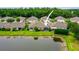 A well-maintained home with a screened lanai overlooking a tranquil pond and a lush green lawn at 31108 Whitlock Dr, Wesley Chapel, FL 33543