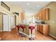 Kitchen with breakfast bar offering a seamless transition to the dining and living spaces at 31108 Whitlock Dr, Wesley Chapel, FL 33543