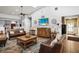 Cozy living room features a decorative ceiling fan, recessed lights and leather couches at 31108 Whitlock Dr, Wesley Chapel, FL 33543