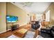Spacious living room with a comfortable layout, connecting seamlessly to the kitchen and dining areas at 31108 Whitlock Dr, Wesley Chapel, FL 33543
