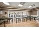 Well-lit meeting room with tile flooring, neutral walls, and ample seating for gatherings at 31108 Whitlock Dr, Wesley Chapel, FL 33543