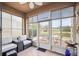 Relaxing screened-in patio with comfortable seating and tranquil views of the pond at 31108 Whitlock Dr, Wesley Chapel, FL 33543