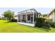 Cozy screened patio area with a table and chairs, perfect for enjoying the outdoors at 31108 Whitlock Dr, Wesley Chapel, FL 33543