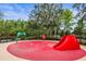 A splash pad with a slide offers water fun for children in the community at 31108 Whitlock Dr, Wesley Chapel, FL 33543