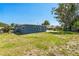 Expansive backyard with well-maintained lawn and views of the home's exterior at 315 Dorchester Dr, Venice, FL 34293
