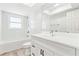 Stylish bathroom with white cabinetry, modern fixtures, and ample natural light at 315 Dorchester Dr, Venice, FL 34293