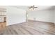 Spacious living room with modern flooring and an open view of the updated kitchen, perfect for entertaining and everyday living at 315 Dorchester Dr, Venice, FL 34293
