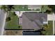 Aerial view of property with fenced backyard, screened-in patio, and well-maintained landscaping at 3201 Pine Top Dr, Valrico, FL 33594