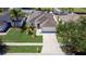 Bird's eye view of a well-maintained home with a lush lawn in a desirable neighborhood at 3201 Pine Top Dr, Valrico, FL 33594