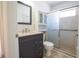 Modern bathroom with sleek vanity, updated fixtures, and a glass-enclosed shower for a luxurious feel at 3201 Pine Top Dr, Valrico, FL 33594