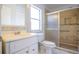 Bathroom featuring a tiled shower, tile floor, and a bright white vanity at 3201 Pine Top Dr, Valrico, FL 33594