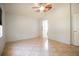 Neutral bedroom with tile flooring, ceiling fan, and ensuite bathroom access at 3201 Pine Top Dr, Valrico, FL 33594