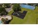 Aerial view of a community with pool, playground, and basketball court at 3201 Pine Top Dr, Valrico, FL 33594