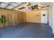 Spacious garage with room for parking, storage shelves, and overhead lighting at 3201 Pine Top Dr, Valrico, FL 33594