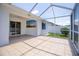 Spacious screened-in patio with ample space for entertaining and access to the fenced-in backyard at 3201 Pine Top Dr, Valrico, FL 33594