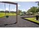 Community playground with swings, slides, and play equipment in a -friendly setting at 3201 Pine Top Dr, Valrico, FL 33594