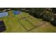 Aerial view of the community recreation area with basketball court, playground, and sports field at 3201 Pine Top Dr, Valrico, FL 33594