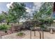 Serene backyard with lush greenery and a patio table, offering a tranquil outdoor space for relaxation at 34389 Orchid Pkwy, Ridge Manor, FL 33523