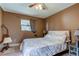 Comfortable bedroom with natural lighting, ceiling fan and soft carpet at 34389 Orchid Pkwy, Ridge Manor, FL 33523