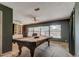 Entertainment space featuring a pool table, built-in shelves, and outdoor views at 34389 Orchid Pkwy, Ridge Manor, FL 33523