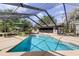 Bright and airy screened-in pool with plenty of room for relaxation and recreation at 34389 Orchid Pkwy, Ridge Manor, FL 33523