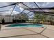 Expansive screened-in pool with ample deck space for entertaining and enjoying sunny days at 34389 Orchid Pkwy, Ridge Manor, FL 33523
