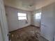 Vacant bedroom features worn walls, flooring, and minimal natural light at 3720 12Th S Ave, St Petersburg, FL 33711