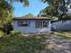 Modest single-story home with a classic facade and a small yard at 3720 12Th S Ave, St Petersburg, FL 33711