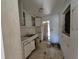 Outdated kitchen features cabinets, sink, and natural light at 3720 12Th S Ave, St Petersburg, FL 33711