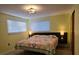 Cozy bedroom featuring plush bedding, modern lighting, and a comfortable atmosphere at 406 2Nd Sw St, Ruskin, FL 33570