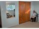 Bedroom includes closet with sliding doors, mirror, and neutral carpet at 406 2Nd Sw St, Ruskin, FL 33570