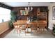 Inviting dining room with wood paneling, stylish furniture, and natural light at 406 2Nd Sw St, Ruskin, FL 33570