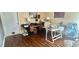 Well-lit office with functional desk, hardwood floors, and a comfortable working space at 406 2Nd Sw St, Ruskin, FL 33570